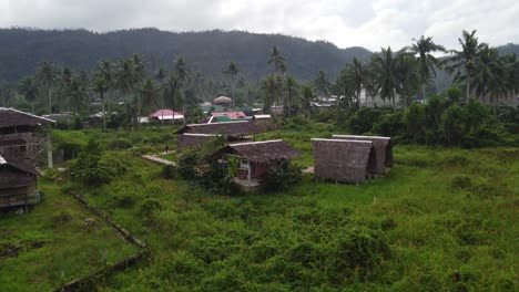 relaxing vacation in remote jungle nature hut of port barton philippines, drone shot