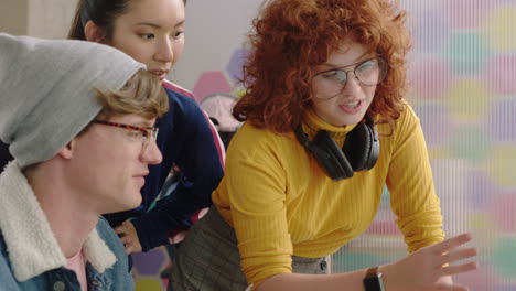 young-business-people-brainstorming-team-leader-woman-pointing-at-screen-sharing-creative-ideas-showing-support-colleagues-discussing-project-enjoying-communication-in-trendy-office