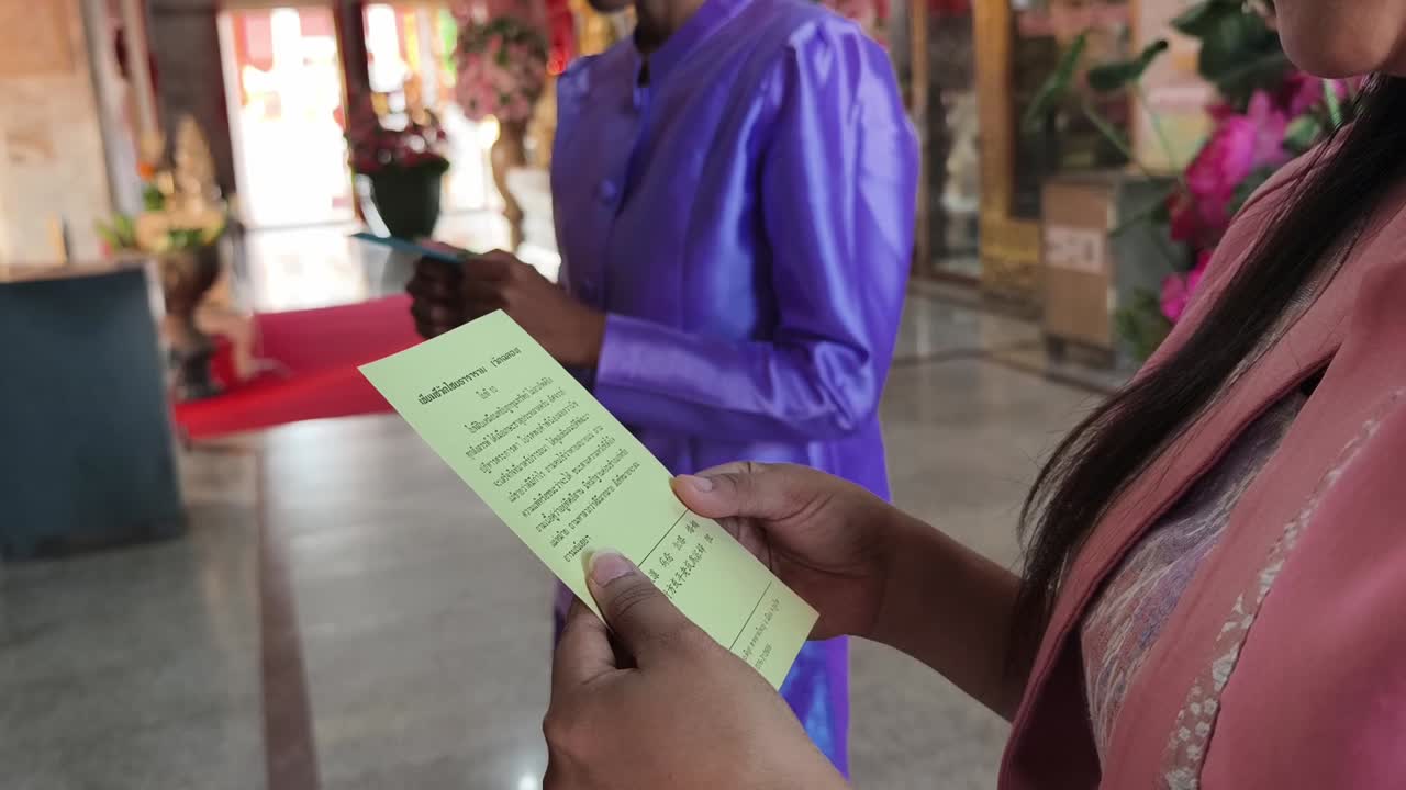 People making offerings in a Thai Temple