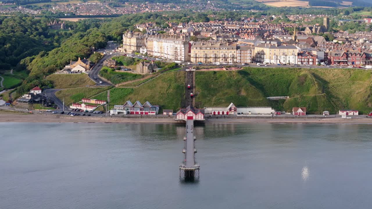approach Aerial drone view of Saltburn-by-the-sea, Saltburn pier and ocean in Cleveland, North Yorkshire in summer, early morning