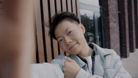 Smiling Person Taking Selfie Outdoors