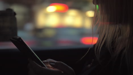 woman surfing net on mobile in the car