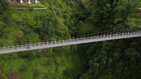 A-tourist-destination-for-the-Girpasang-suspension-bridge-which-has-a-means-of-crossing,-namely-the-gondola-on-the-slopes-of-Mount-Merapi