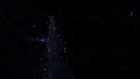 Avenue-in-Buenos-Aires-at-night,-drone-view