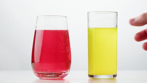 two glasses of colorful drinks