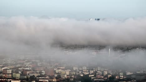 city shrouded in morning fog