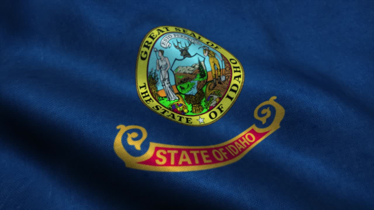 la bandera de idaho ondeando en el viento. la bandera nacional de idaho. el signo de idaho animación de bucle sin costuras. 4k