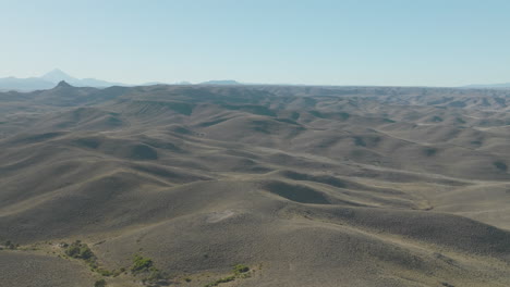 stunning wide angle aerial panning shot overlooking the hilly wilderness of argentina