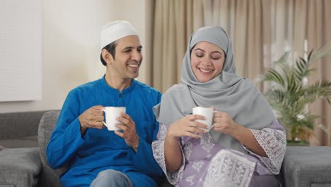 muslim wife bringing tea for husband