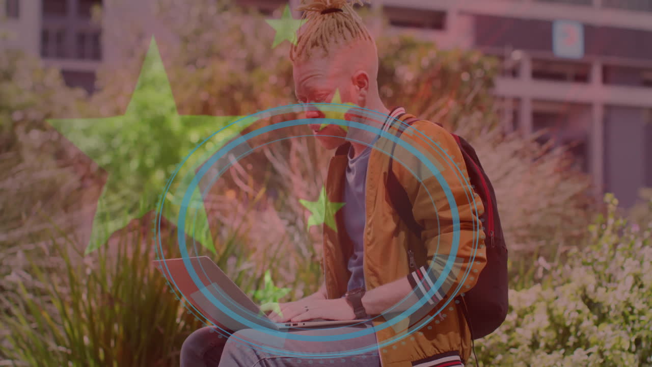 Person with laptop outdoors, digital data processing animation overlay with stars