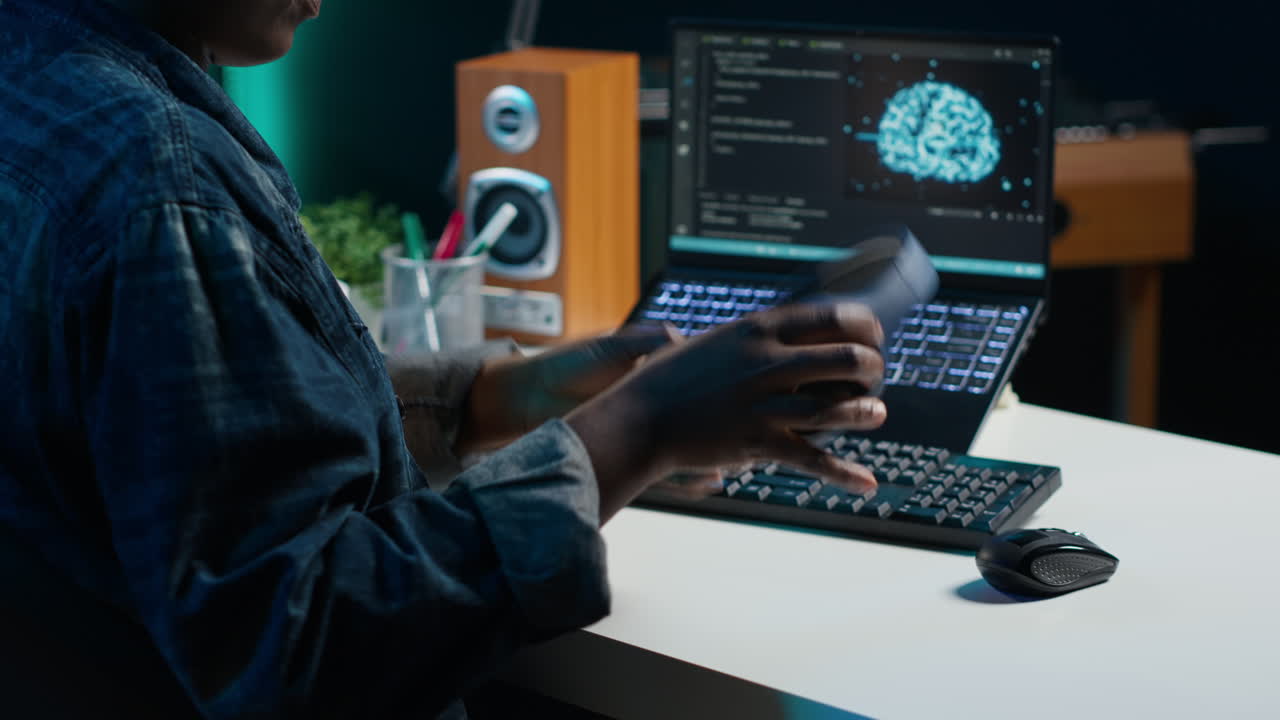 Person Coding on a Laptop with AI Visualization