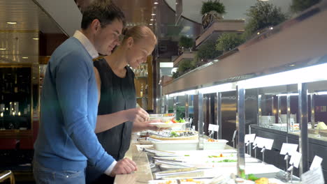 couple by self-service buffet