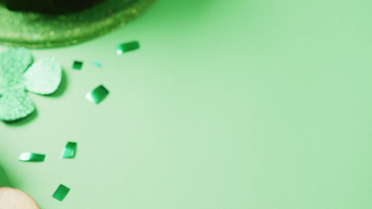 Video of st patrick's green hat with copy space on green background