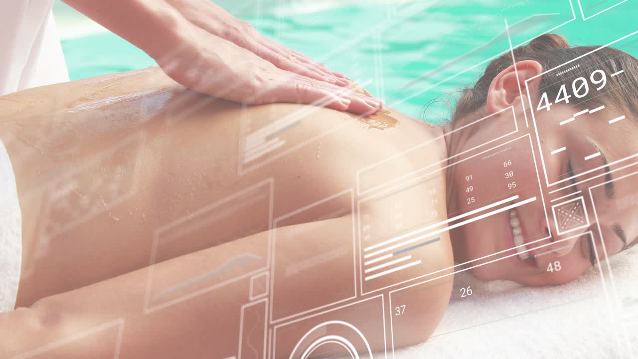 Woman lying on spa table poolside therapist pumping oil kneading back with data overlays for rest