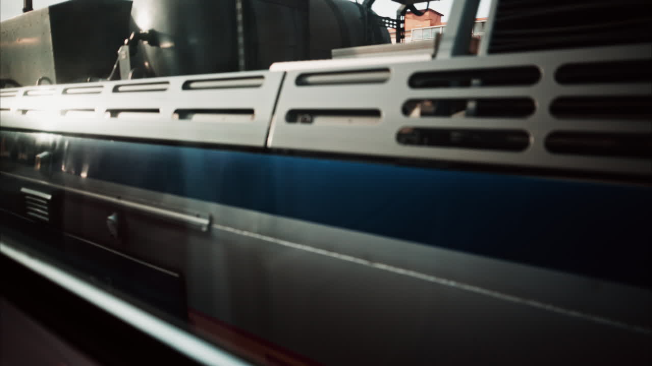 Close up of a train moving on the rails near a station in the south of France