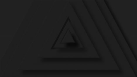 animation of black triangle layers pulsating on black background