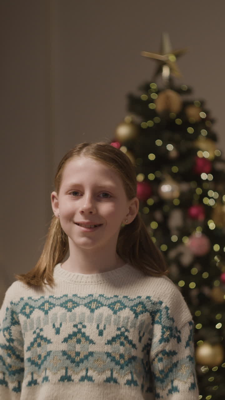 Girl in front of Christmas tree