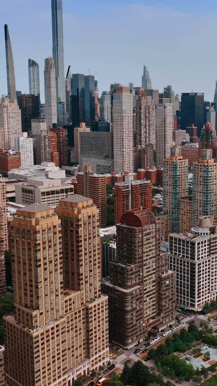 Non-repeating buildings in the architecture of New York at Hudson waterfront. Famous Skyscrapers at backdrop. Vertical video