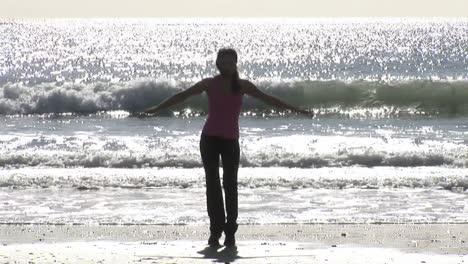 woman working out at beach