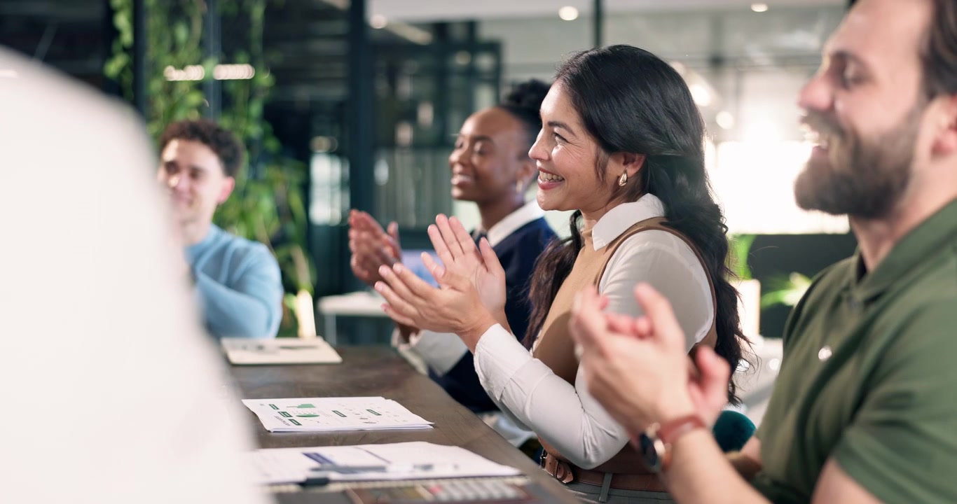 Diverse Business Team Applauding During a Meeting in a Modern Office