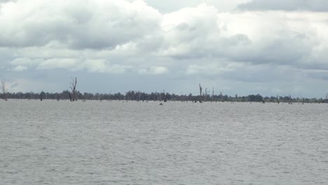 Outdoor-nature-static-shot-of-lake-on-windy-cloudy-rainy-winters-day