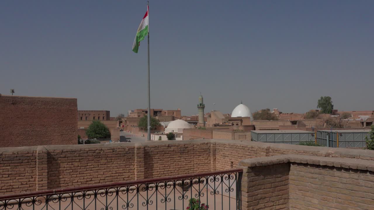 The newly rebuilt and renovated citadel in Erbil, Kurdistan Iraq and World Heritage Site with the flag of Kurdistan blowing in the breeze