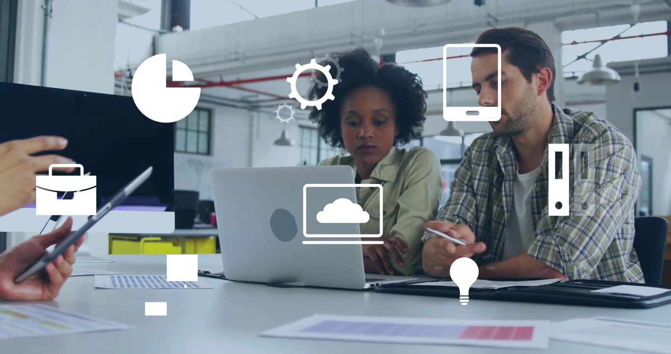 Three colleagues collaborating at open-plan tech office, with floating gear pie chart cloud icons