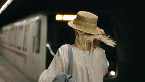 woman waiting for a subway train