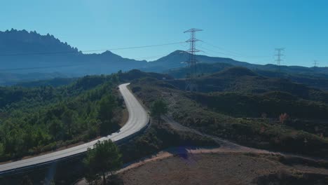 electricity towers and montserrat in forest of crosses