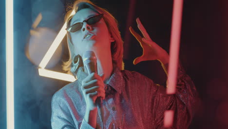 woman singing with neon lights