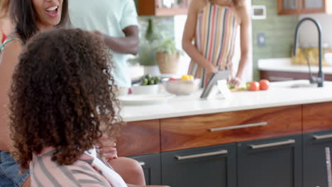 Diverse-family-enjoys-time-in-a-modern-kitchen