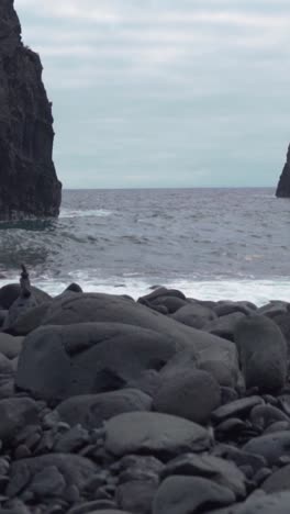 rocky volcanic beach with waves