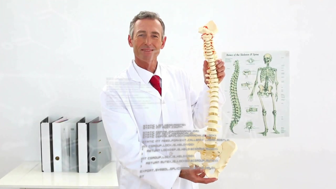 Male medical doctor picking spinal model pointing vertebrae rotating with chart explaining spine