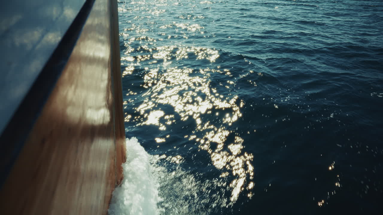 Pov: Fishing boat navigating in the sea. View of the waves as the boat cuts through the sea.