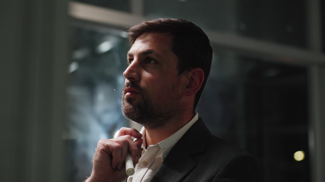 Thoughtful Businessman Looking Up in Modern Office