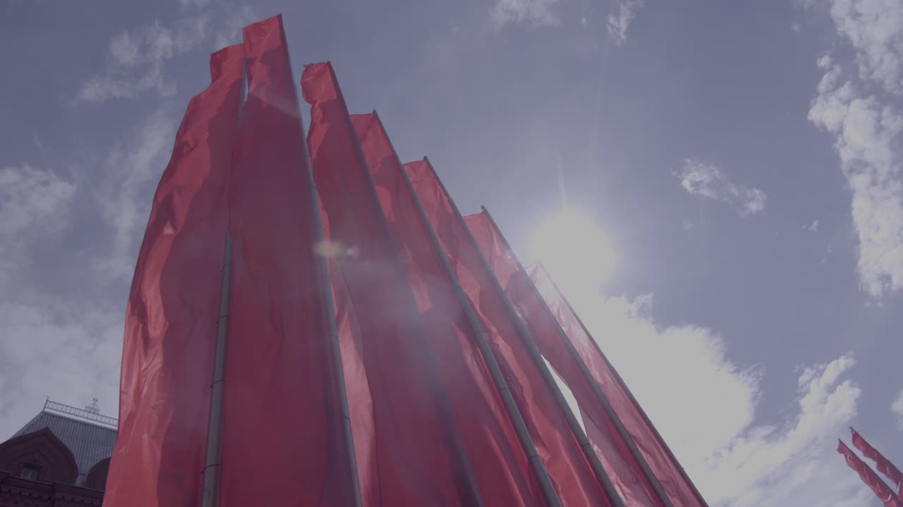 Red flags waving against sky on Victory Day, Moscow Red Square, Russia