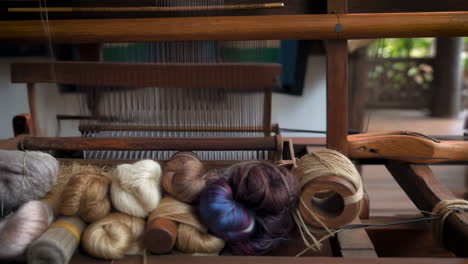 close-up of a loom with yarn