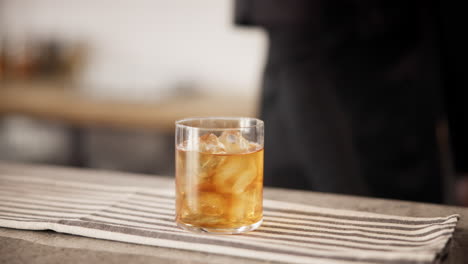 bartender preparing an old fashioned cocktail