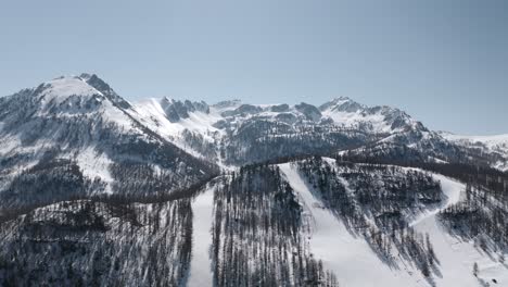 Alpine-mountains-covered-in-snow-during-winter-captured-by-drone