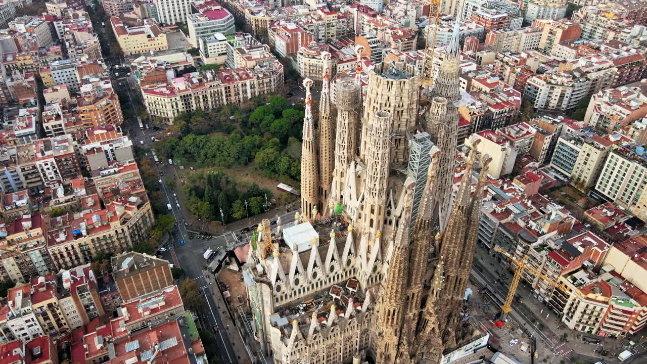 Aerial drone view of Barcelona, Spain. Blocks with multiple residential buildings and Sagrada Familia