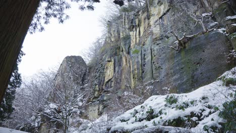 icy cliffs in forest of yamadera temple, yamagata japan