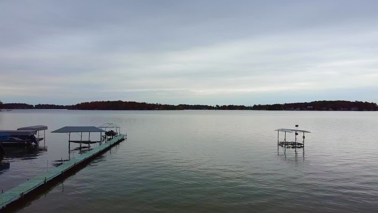 Drone footage of a Michigan beach, lake, and docked boats