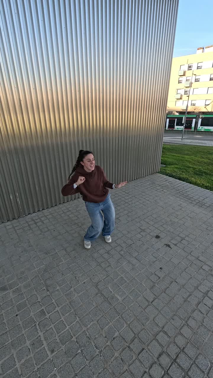 Young breakdancer performing energetic moves outdoors