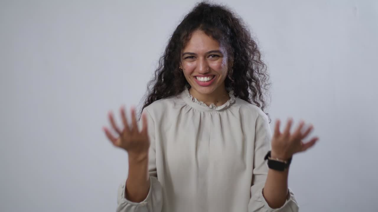 A smiling woman with curly hair