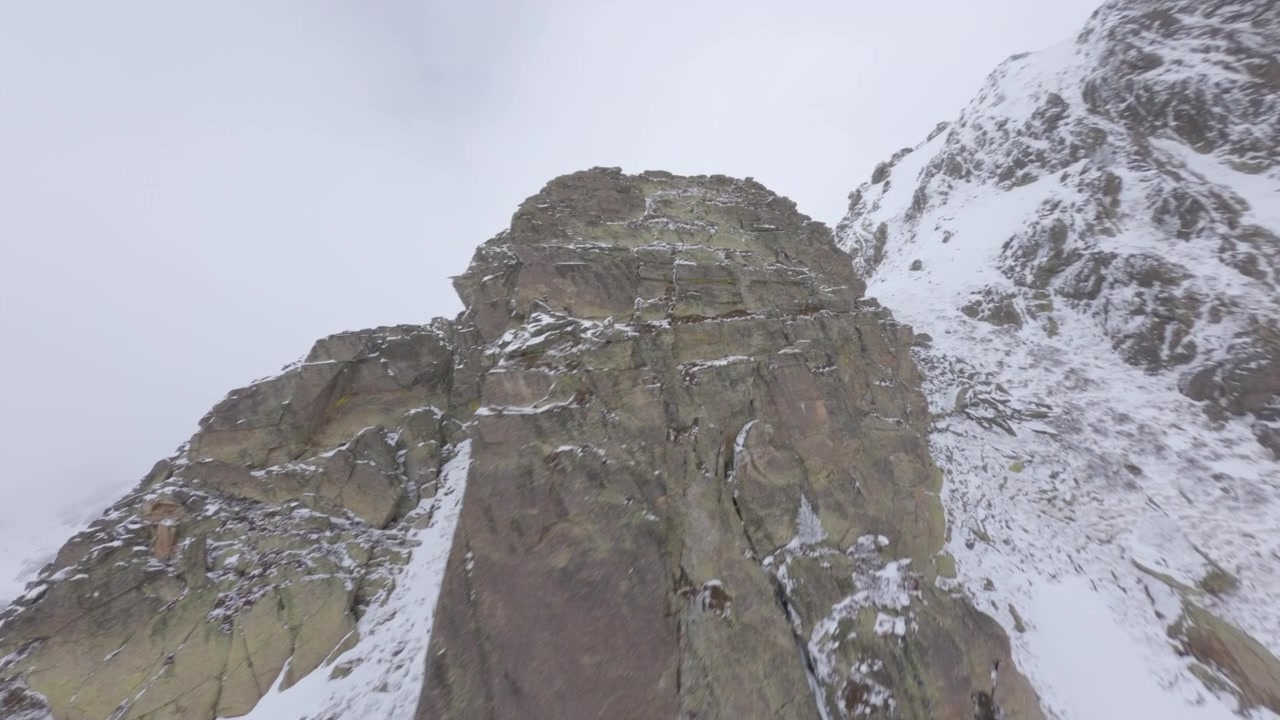 Andorran mountain peaks, Vall d’Incles summit, FPV drone aerial shot, winter
