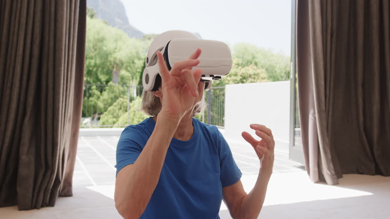 Senior woman using VR headset, exploring virtual world at home