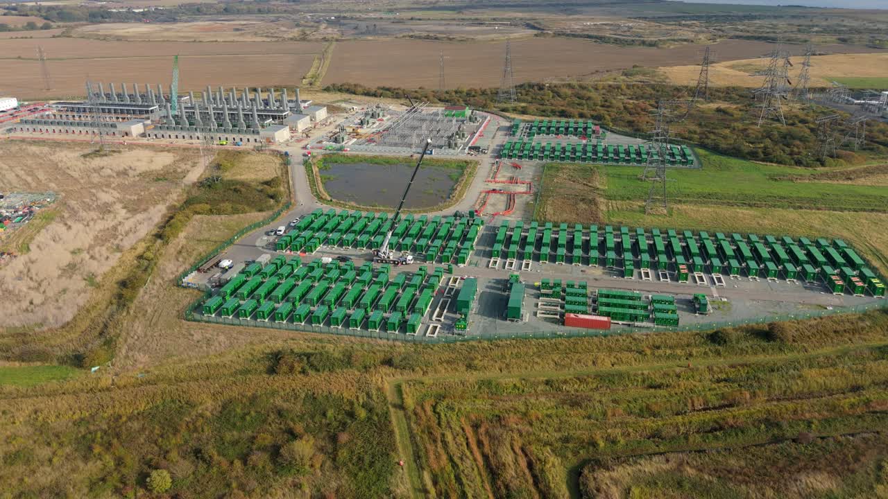 Cinematic Aerial Drone Video of Modern Battery Energy Storage Systems for Grid Stability and Electrical Infrastructure in Tilbury England