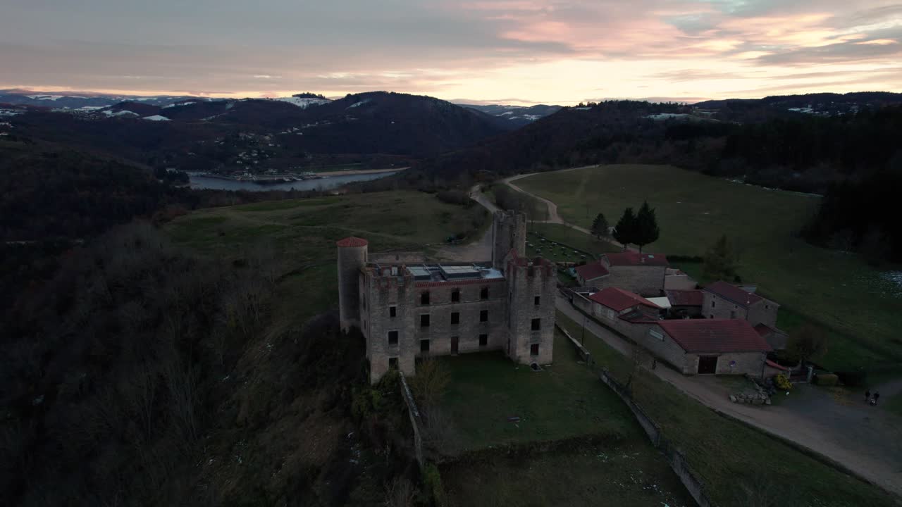 Aerial drone shot of Essalois Castle in the Gorges de la Loire near Saint Etienne at sunset, Loire departement , Auvergne rhone alpes region, France