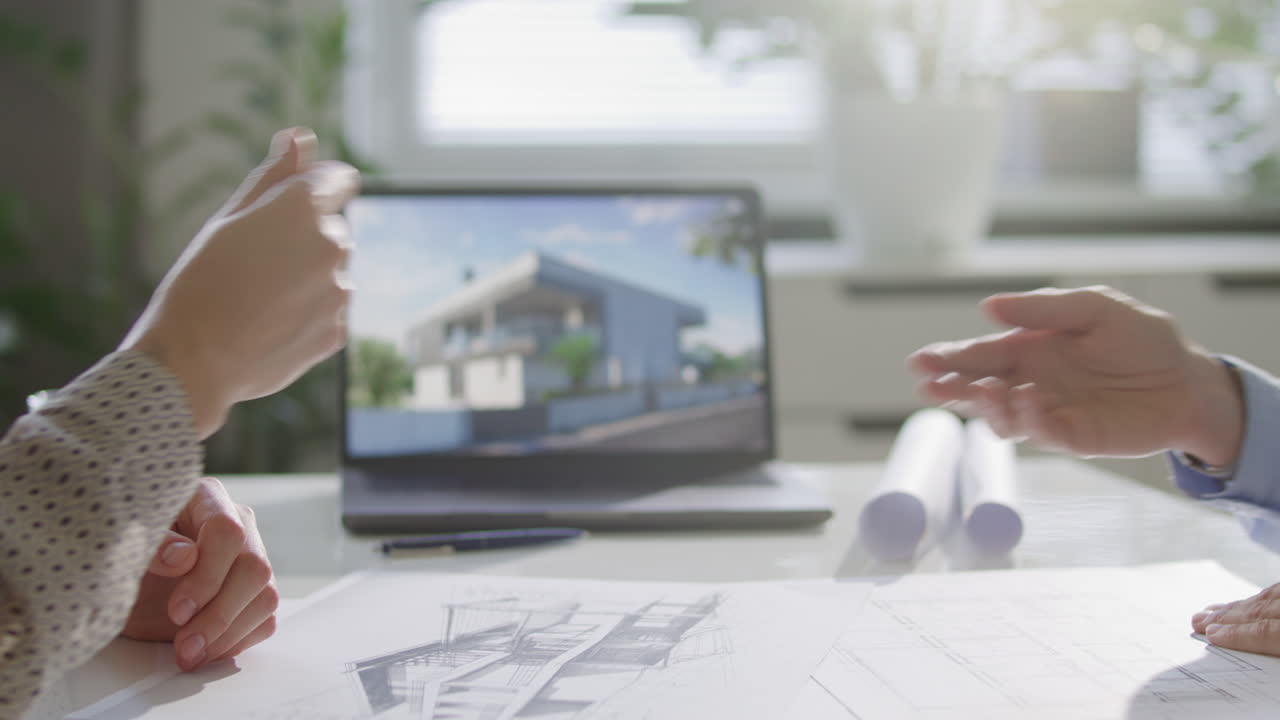 Hand of Real Estate Agent Giving Keys to Customer above Office Desk