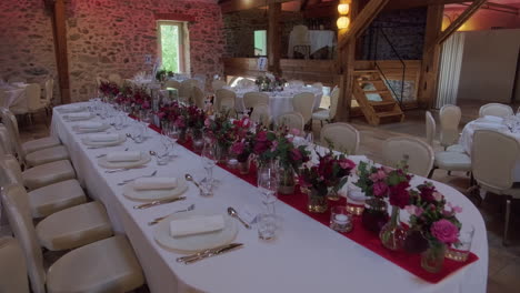 push in shot of wedding dinner table and flowers in the garden of iris in vullierens, canton of vaud, switzerland, slow motion
